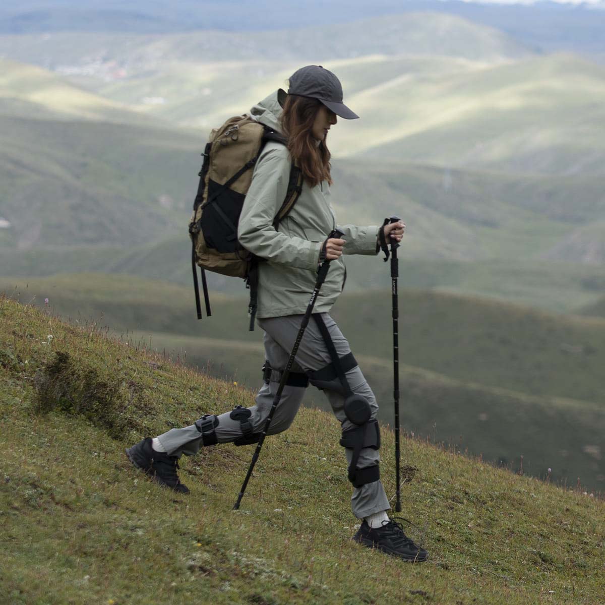 Powered knee exoskeleton assisting a hiker during downhill walking